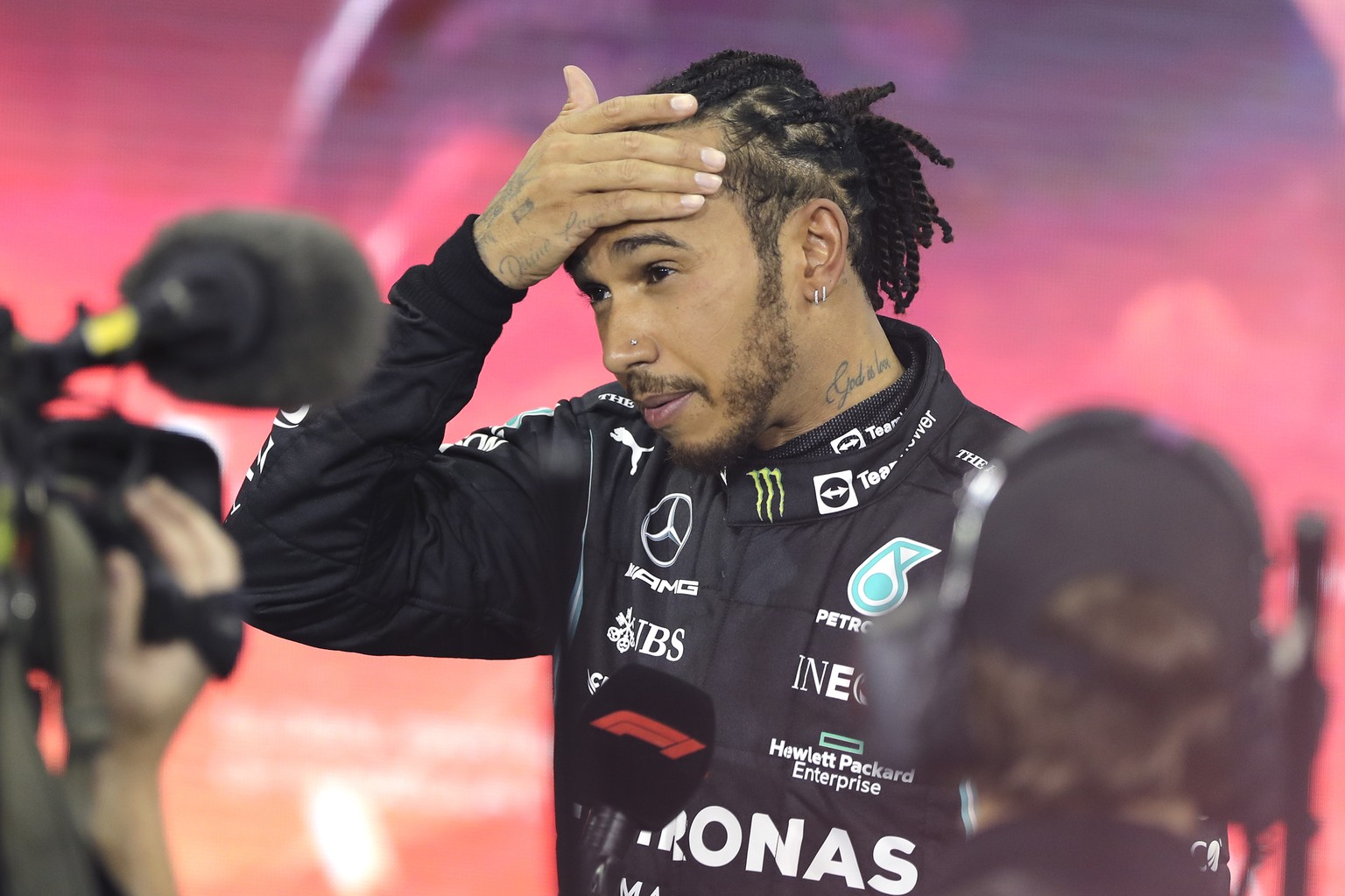 Mercedes driver Lewis Hamilton of Britain reacts after finishing second in the Formula One Abu Dhabi Grand Prix in Abu Dhabi, United Arab Emirates, Sunday, Dec. 12. 2021. Max Verstappen ripped a recor ...