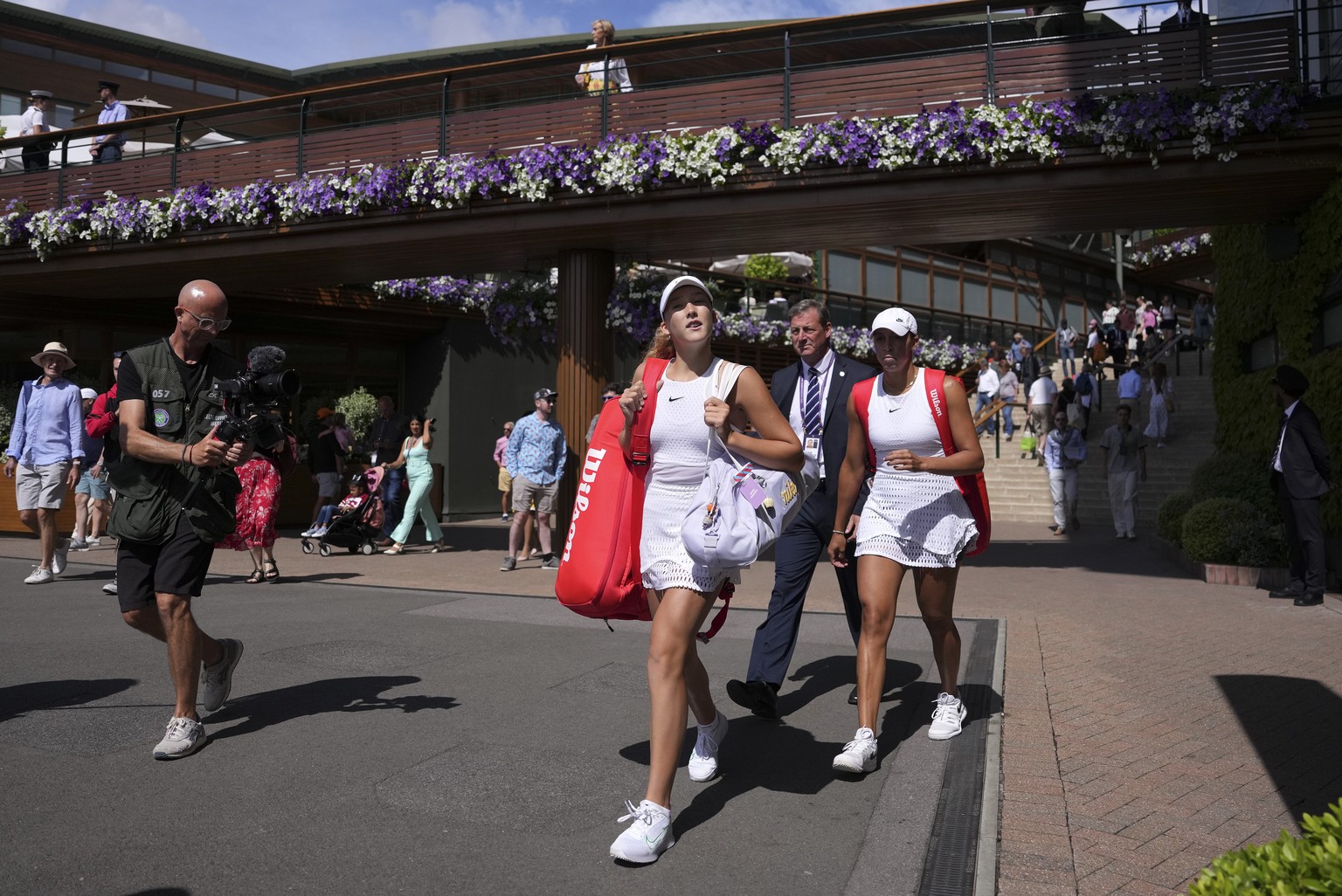 Russia&#039;s Mirra Andreeva, left, and Madison Keys of the US arrive to play in a women&#039;s singles match on day eight of the Wimbledon tennis championships in London, Monday, July 10, 2023. (AP P ...
