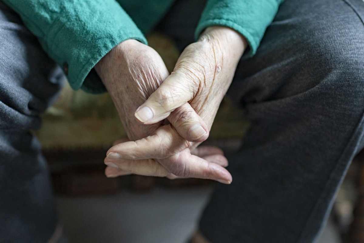 HEIDELBERG, GERMANY - MARCH 30: In this photo illustration an old man is crossing his hands on March 30, 2022 in Heidelberg, Germany. (Photo Illustration by Ute Grabowsky/Getty Images)