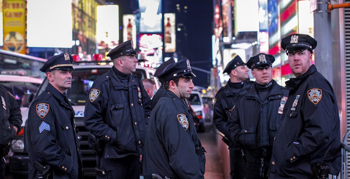 NEW YORK, NY - DECEMBER 4: New York City police pause as they block demonstrators on Times Square following yesterday's decision by a Staten Island grand jury not to indict a police officer who u ...