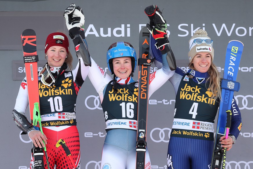 epa08140814 (L-R) Second placed Elisa Moerzinger of Austria, winner Clara Direz of France and third placed Marta Bassino of Italy celebrate on the podium after the women&#039;s Parallel Giant Slalom r ...
