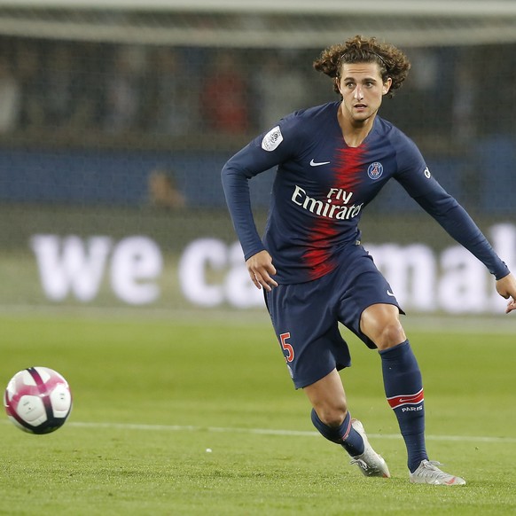 In this Sept. 26, 2018, photo, PSG&#039;s Adrien Rabiot controls the ball during the French League One soccer match between Paris-Saint-Germain and Reims at Parc des Princes stadium in Paris, France.  ...