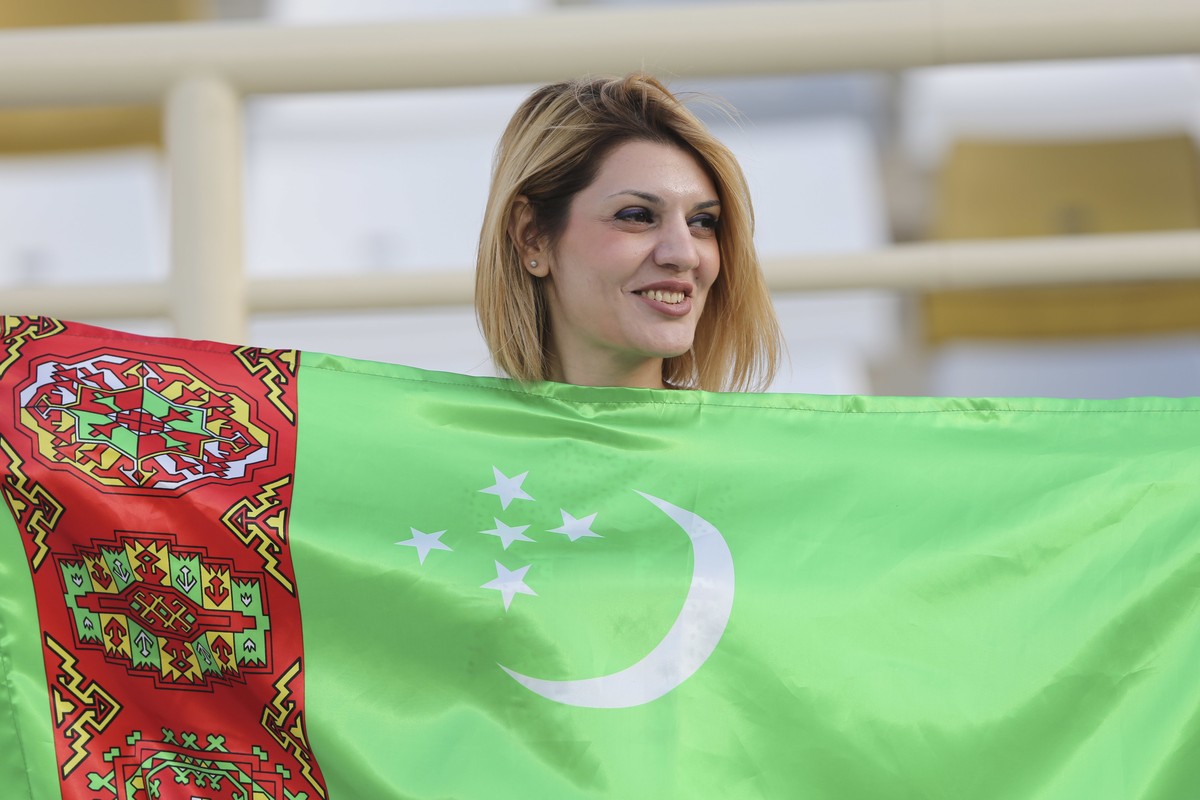 Turkmenistan's soccer team supporter smile during the AFC Asian Cup group F soccer match between Japan and Turkmenistan at Al Nahyan Stadium in Abu Dhabi, United Arab Emirates, Wednesday, Jan. 9, ...