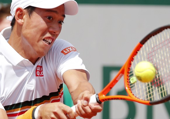 Japan&#039;s Kei Nishikori returns the ball to Spain&#039;s Fernando Verdasco during their fourth round match of the French Open tennis tournament at the Roland Garros stadium, Monday, June 5, 2017 in ...