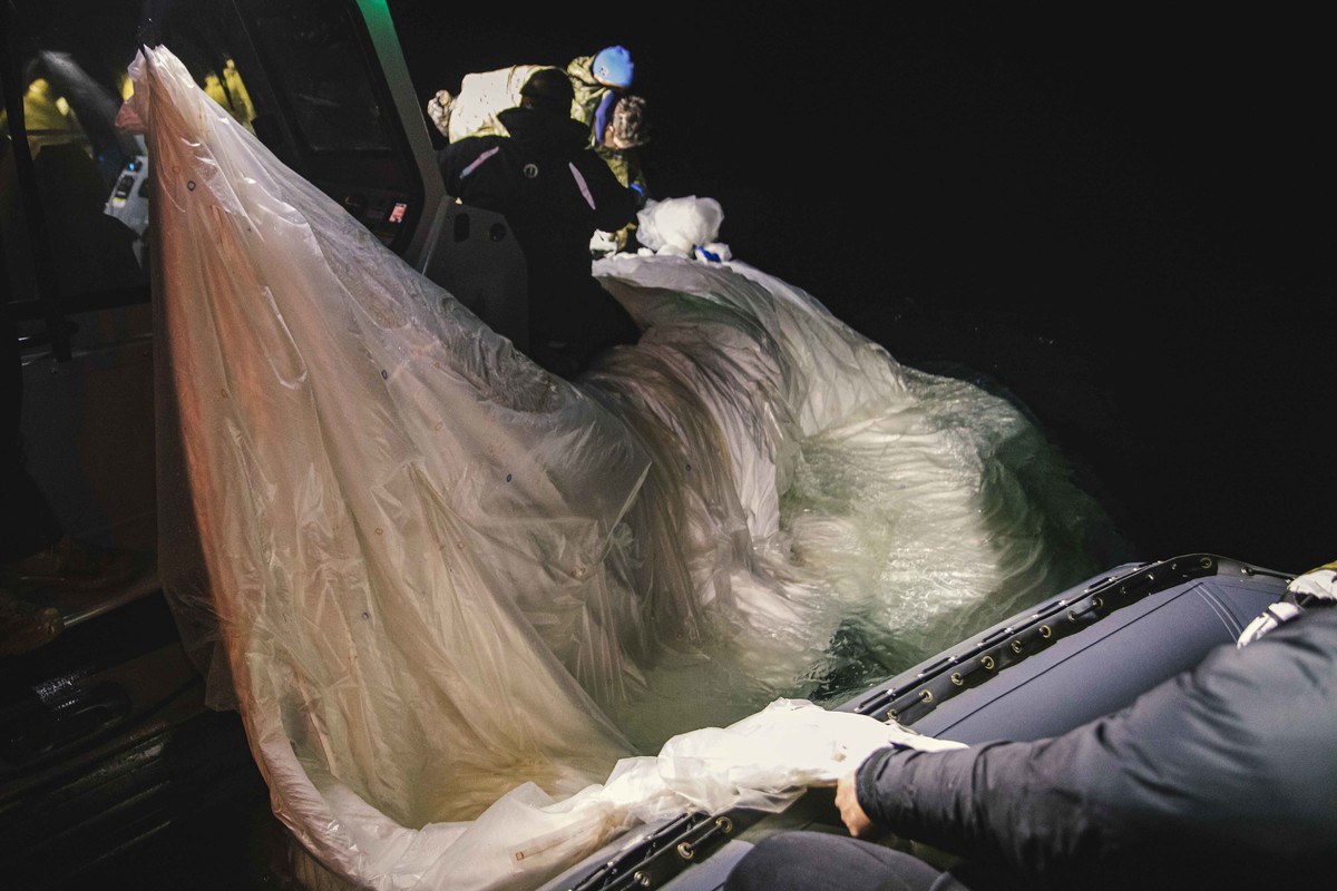 FILE - This image provided by the U.S. Navy shows sailors assigned to Explosive Ordnance Disposal Group 2 recovering a high-altitude surveillance balloon off the coast of Myrtle Beach, S.C., Feb. 5, 2 ...