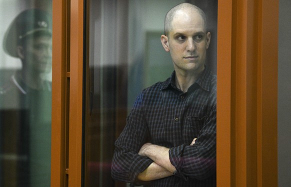 FILE - Wall Street Journal reporter Evan Gershkovich stands in a glass defendant&#039;s booth in a courtroom in Yekaterinburg, Russia, on June 26, 2024. (AP Photo, File)
