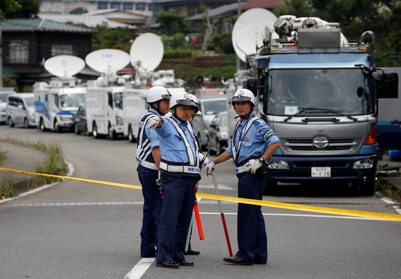 Police officers stand guard at a facility for the disabled, where a deadly attack by a knife-wielding man took place, in Sagamihara, Kanagawa prefecture, Japan, July 26, 2016. REUTERS/Issei Kato