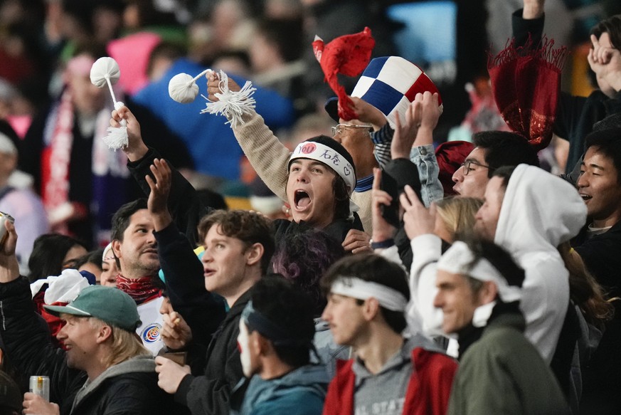 Spectators react during the Women&#039;s World Cup Group C soccer match between Japan and Costa Rica in Dunedin, New Zealand, Wednesday, July 26, 2023. (AP Photo/Alessandra Tarantino)