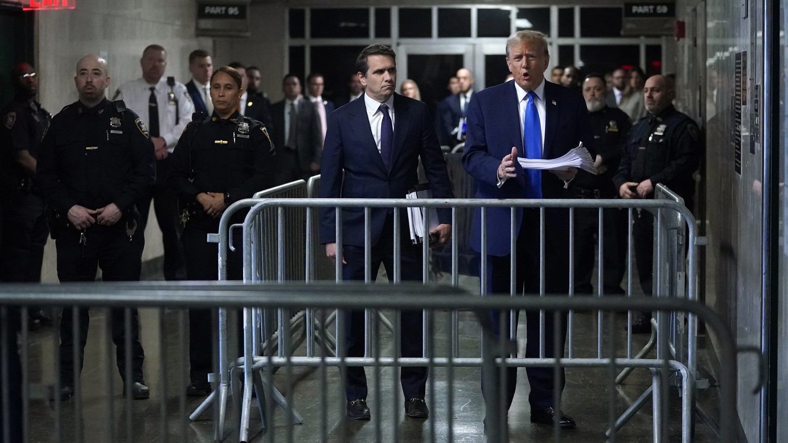 Former President Donald Trump, right, stands with his attorney Todd Blanche as he leaves for the day following jury selection for his trial at Manhattan criminal court in New York, on Thursday, April  ...