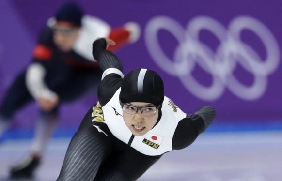 Gold medalist and new Olympic record holder Japan's Nao Kodaira, front, and bronze medalist Karolina Erbanova of the Czech Republic, rear, compete during the women's 500 meters speedskating race at the Gangneung Oval at the 2018 Winter Olympics in Gangneung, South Korea, Sunday, Feb. 18, 2018. (AP Photo/Petr David Josek)