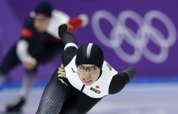 Gold medalist and new Olympic record holder Japan&#039;s Nao Kodaira, front, and bronze medalist Karolina Erbanova of the Czech Republic, rear, compete during the women&#039;s 500 meters speedskating  ...