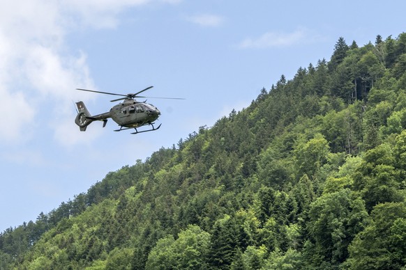 epa11402482 A Swiss Armed Forces helicopter takes off from the helicopter base in front of the Buergenstock Resort during a media tour of the security precautions of the Nidwalden Cantonal Police and  ...