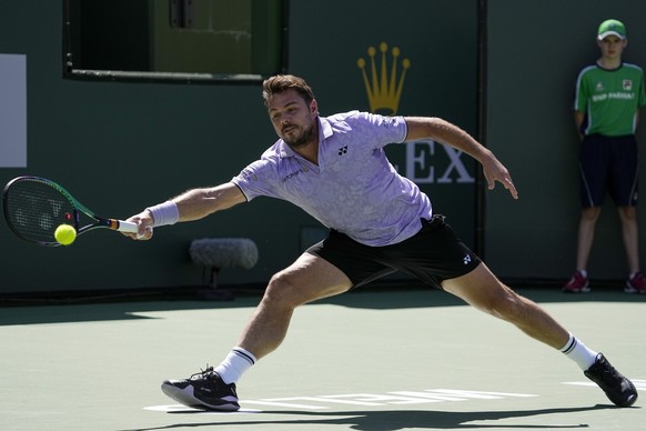 Stan Wawrinka, of Switzerland, serves to Holger Rune, of Denmark, at the BNP Paribas Open tennis tournament Monday, March 13, 2023, in Indian Wells, Calif. (AP Photo/Mark J. Terrill)