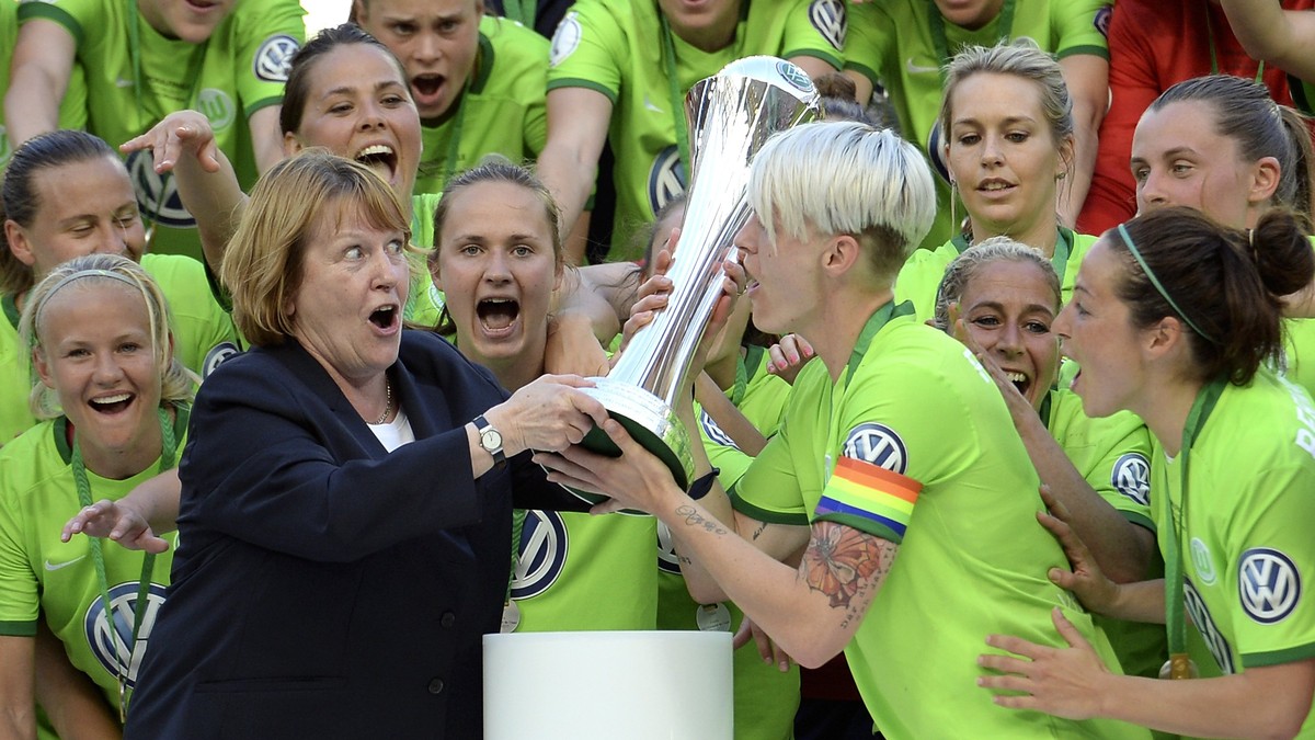 epa05993670 Wolfburg's team captain Nilla Fischer (C-R) lifts the trophy after winning the German Women's DFB Cup final between SC Sand and VfL Wolfsburg at Rheinenergiestadion in Cologne, G ...