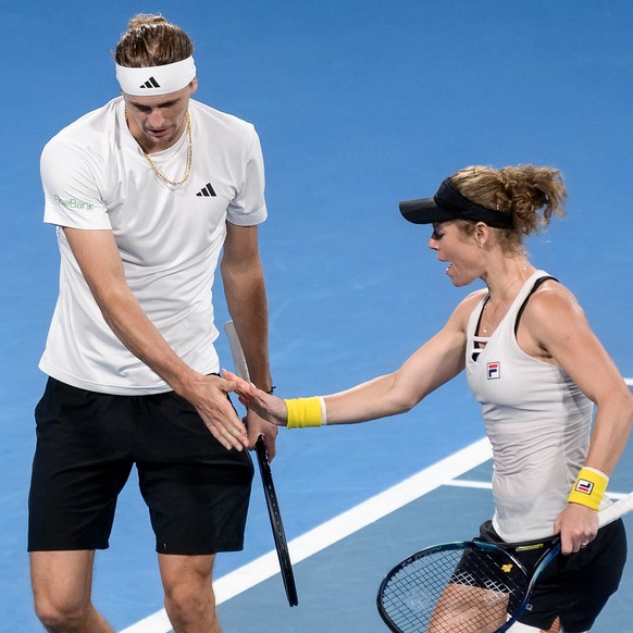epa11062433 Laura Siegemund and Alexander Zverev of Germany in action against Iga Swiatek and Hubert Hurkacz of Poland during their doubles match for the final of the 2024 United Cup between Poland an ...