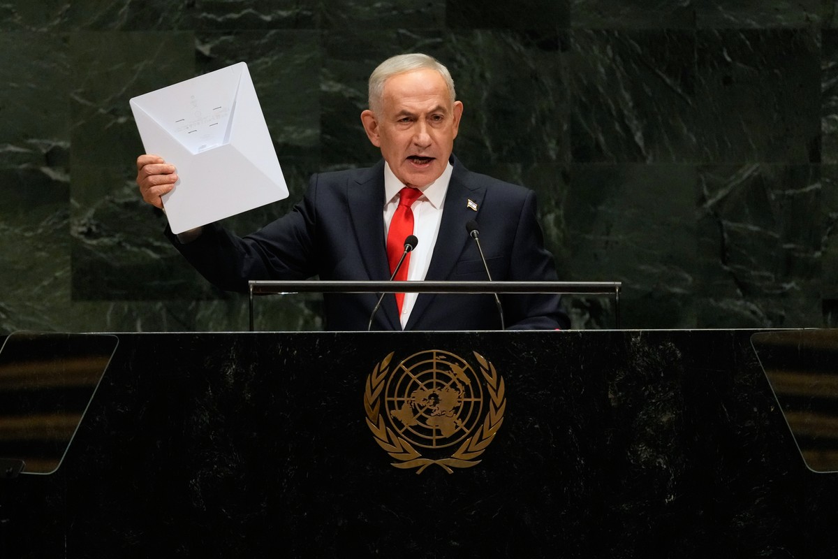 Israeli Prime Minister Benjamin Netanyahu holds up a Starlink satellite internet dish a he speaks during the 81st session of the United Nations General Assembly at United Nations headquarters, Thursda ...