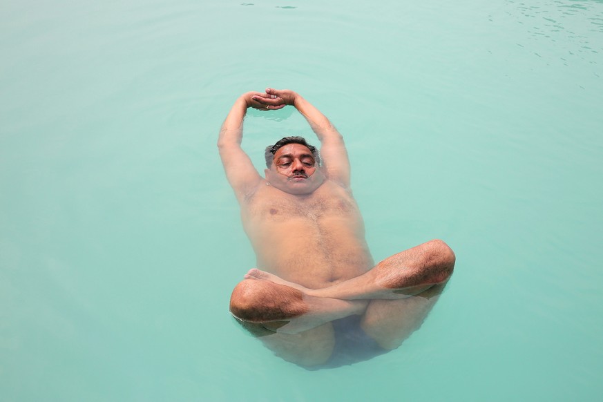 epa05379177 Indian water yoga expert Laxmi Yadav performs water yoga in a pool in preperation for the International Day of Yoga in Bhopal, India, 20 June 2016. The United Nations declared 21 June as t ...