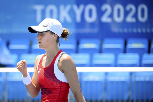 Viktorija Golubic of Switzerland celebrates after winning the first set against Maria Camila Osorio Serrano of Colombia during the women&#039;s single tennis first round match at the 2020 Tokyo Summer ...