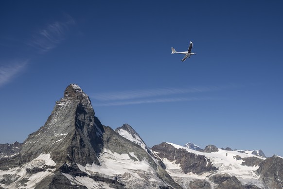epa12245107 SolarStratos, a solar powered aircraft prototype, flown by Swiss adventurer Raphael Domjan flies by the iconic Matterhorn mountain during a scouting and test flight near the alpine village ...