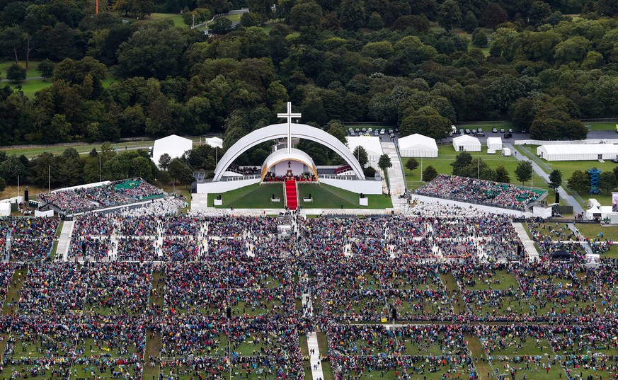 epa06974349 An aerial view of the pilgrims and cross during Pope Francis visit at the Knock Shrine, in Coutny Mayo, Ireland, 26 August 2018. The pontiff is visiting Ireland on 25 and 26 August 2018 to ...