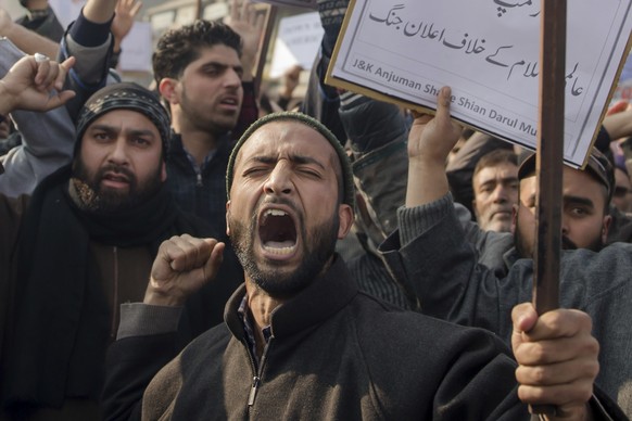 Kashmiri Muslims shouts slogans during a protest against President Donald Trump&#039;s decision to recognize Jerusalem as Israel&#039;s capital in Budgam, southwest of Srinagar, Indian controlled Kash ...