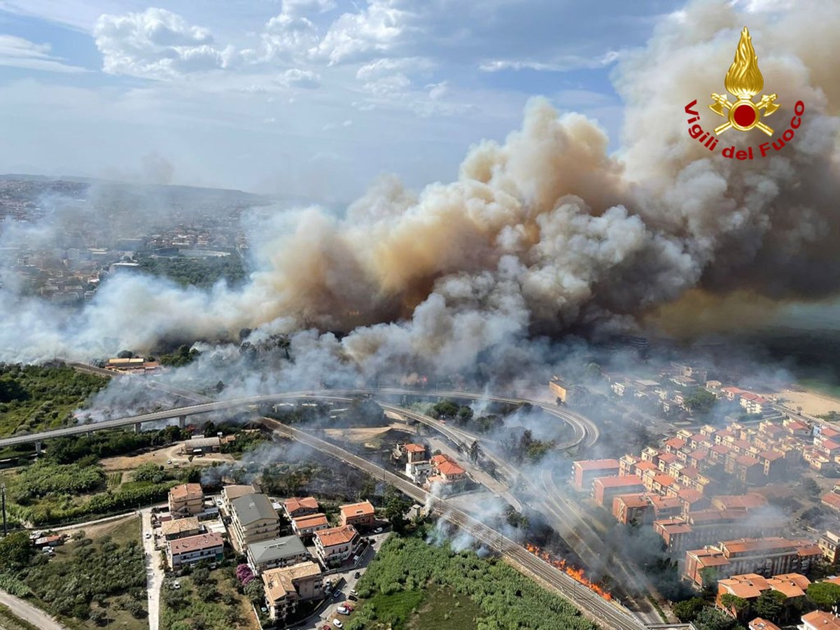 epa09387602 A handout photo made available by Vigili del Fuoco (VVF), the Italian National Fire Brigade, shows an aerial view of a fire in the Pineta Dannunziana reserve in Pescara, Abruzzo region, ce ...