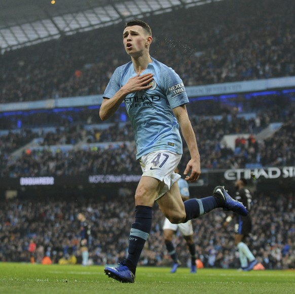 Manchester City&#039;s Phil Foden celebrates after scoring his sides 2nd goal during the English FA Cup third round soccer match between Manchester City and Rotherham United at Etihad stadium in Manch ...