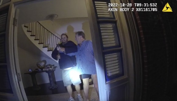 FILE - In this image taken from San Francisco Police Department body-camera video, the husband of former U.S. House Speaker Nancy Pelosi, Paul Pelosi, right, fights for control of a hammer with his as ...