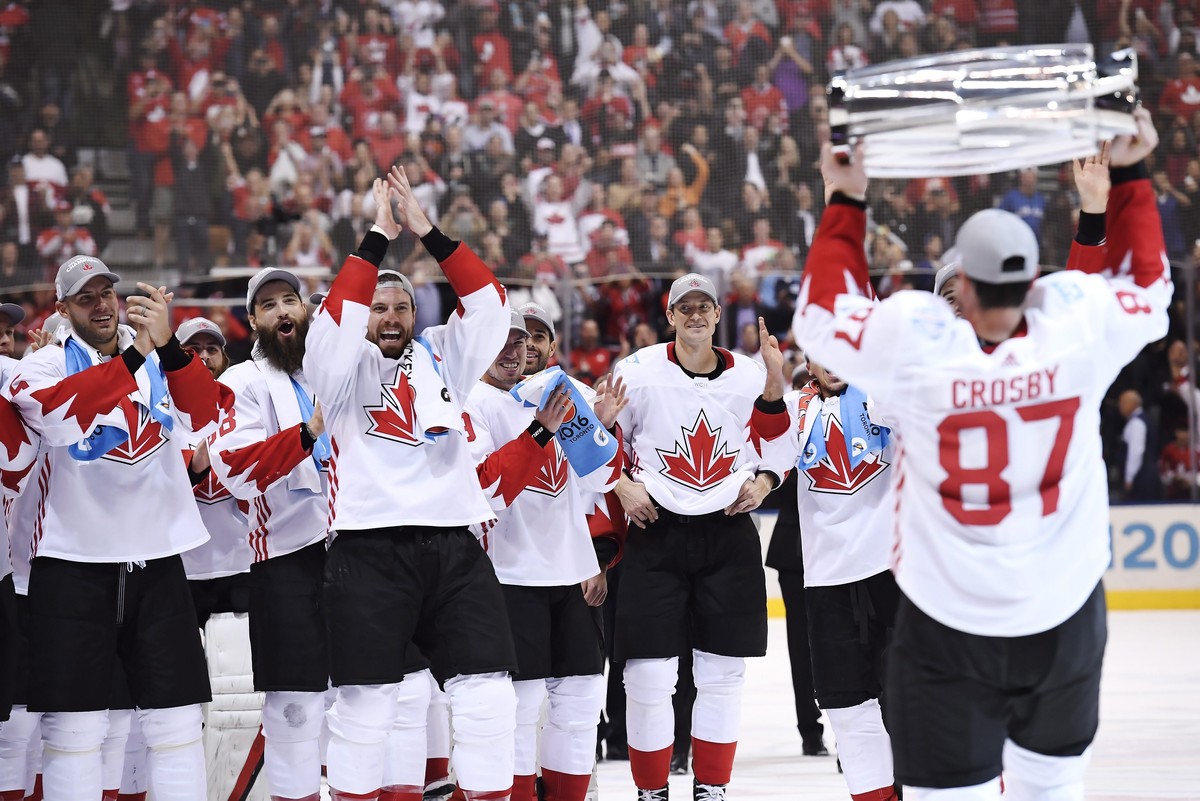 FILE - Canada's Sidney Crosby (87) hoists the trophy in front of teammates following Canada's 2-1 victory over Europe in Game 2 of the final to win the World Cup of Hockey, in Toronto, Sept. ...