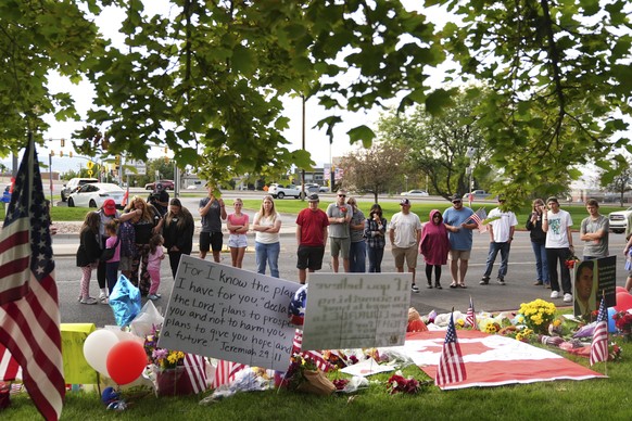Supporters gather at a makeshift memorial in Orem, Utah, Saturday, Sept. 13, 2025, at Utah Valley University for Turning Point USA CEO and co-founder Charlie Kirk who was fatally shot during an event  ...