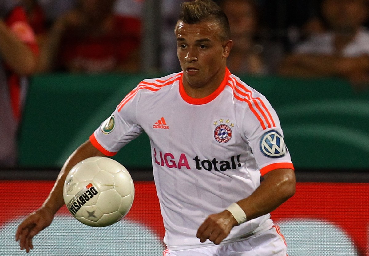 REGENSBURG, GERMANY - AUGUST 20: Xherdan Shaqiri of Bayern Muenchen kicks the ball during the DFB Cup first round match between Jahn Regensburg and Bayern Muenchen on August 20, 2012 in Regensburg, Ge ...