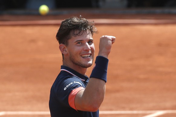 Austria&#039;s Dominic Thiem celebrates winning as the ball goes out in the semifinal of the French Open tennis tournament against Italy&#039;s Marco Cecchinato at the Roland Garros stadium in Paris,  ...