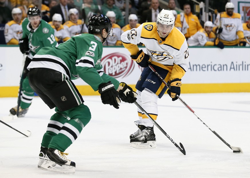 Dallas Stars defenseman John Klingberg (3) defends as Nashville Predators left wing Kevin Fiala (22) prepares to make a pass during the second period of an NHL hockey game Tuesday, Dec. 5, 2017, in Da ...