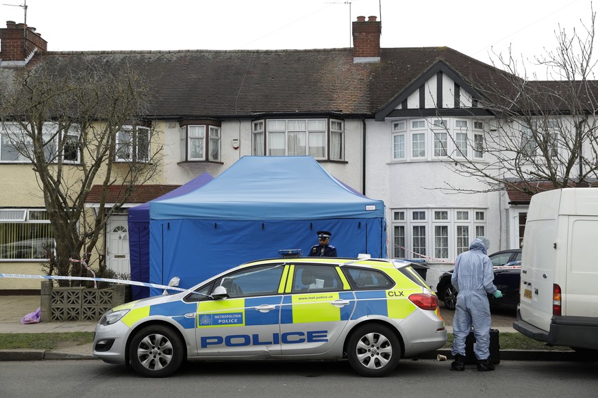 FILE - In this Wednesday, March 14, 2018 file photo, police work at the scene outside a house in New Malden, south west London, which has been sealed-off after Russian businessman Nikolai Glushkov was ...