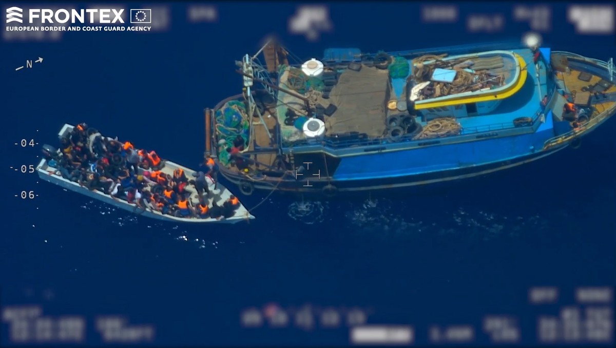 epa07669905 A screen grab taken from an undated handout video made available by the European Border and Coast Guard Agency (Frontex) on 24 June 2019 shows migrants coming out of from a fishing trawler ...