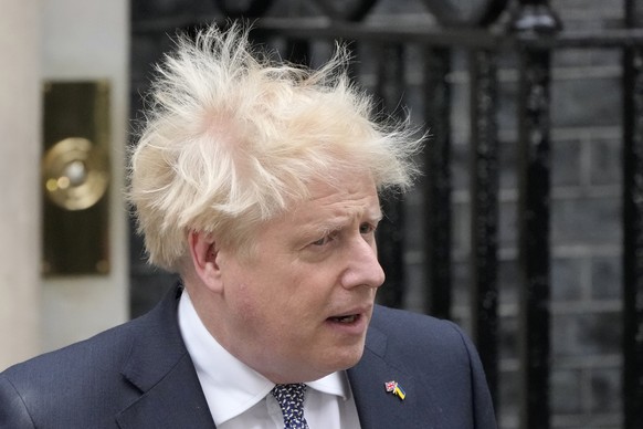 Prime Minister Boris Johnson arrives to read a statement outside 10 Downing Street, London, formally resigning as Conservative Party leader, in London, Thursday, July 7, 2022. Johnson said Thursday he ...