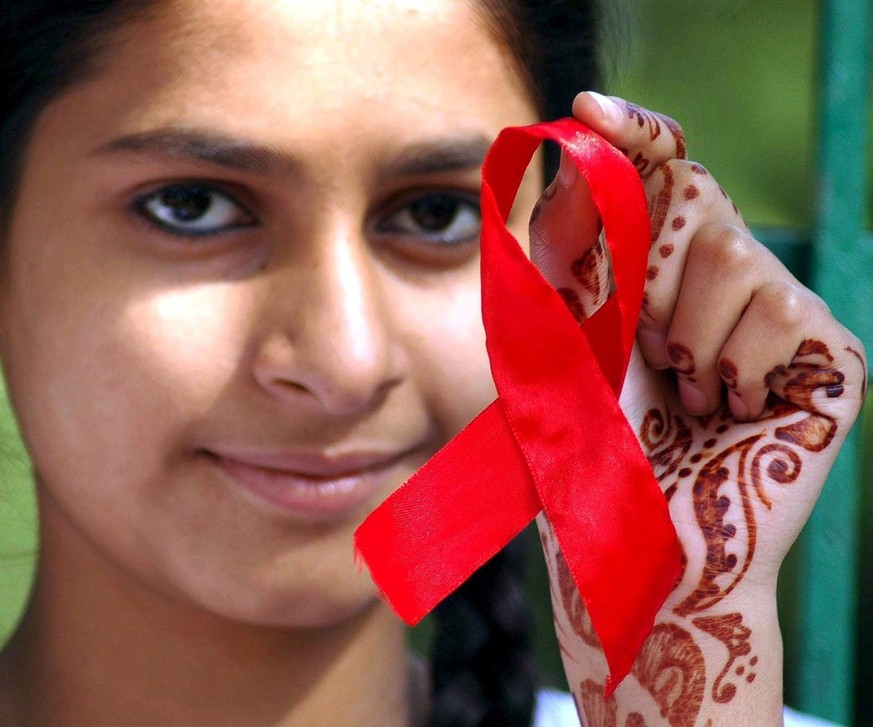 A school girl participatse in an awareness rally to express solidarity in the fight against HIV/AIDS to mark World AIDS Day, in Bhopal, Madhya Pradesh on Friday 01 December 2006. In India there are ne ...