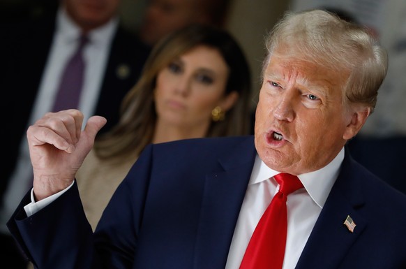 epa10900123 Former US President Donald J. Trump speaks to the media during a lunch break on the third day of his civil fraud trial in New York, New York, USA, 04 October 2023. Trump, his adult sons an ...