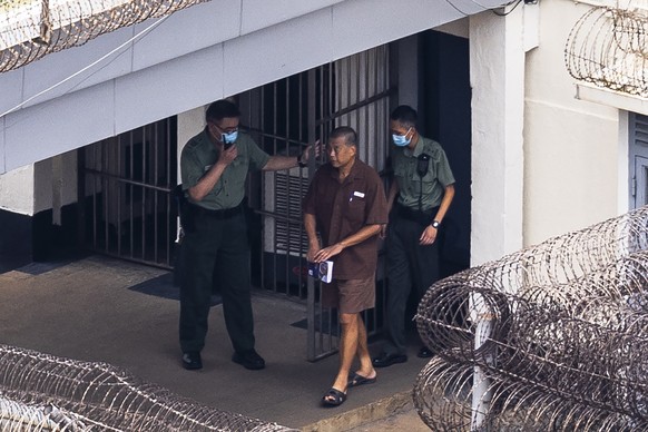 FILE - Jimmy Lai walks through Stanley Prison in Hong Kong on July 28, 2023.  The trial of Hong Kong's most famous activist publisher, who was arrested during China's crackdown on dissidents, will...