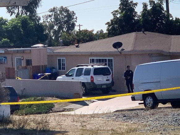 San Diego police investigate a shooting that killed five members of a family and wounded one more in Paradise Hills on Saturday, Nov. 16, 2019 in San Diego, Calif. Police said two adults and three chi ...