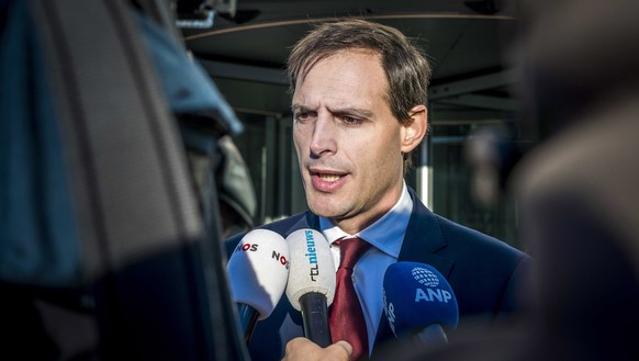 epa07371898 Dutch Minister of Finances Wopke Hoekstra speaks to journalists after a meeting with his cabinet colleague, Infrastructure Minister Cora van Nieuwenhuizen and Ben Smith, the chairman of th ...