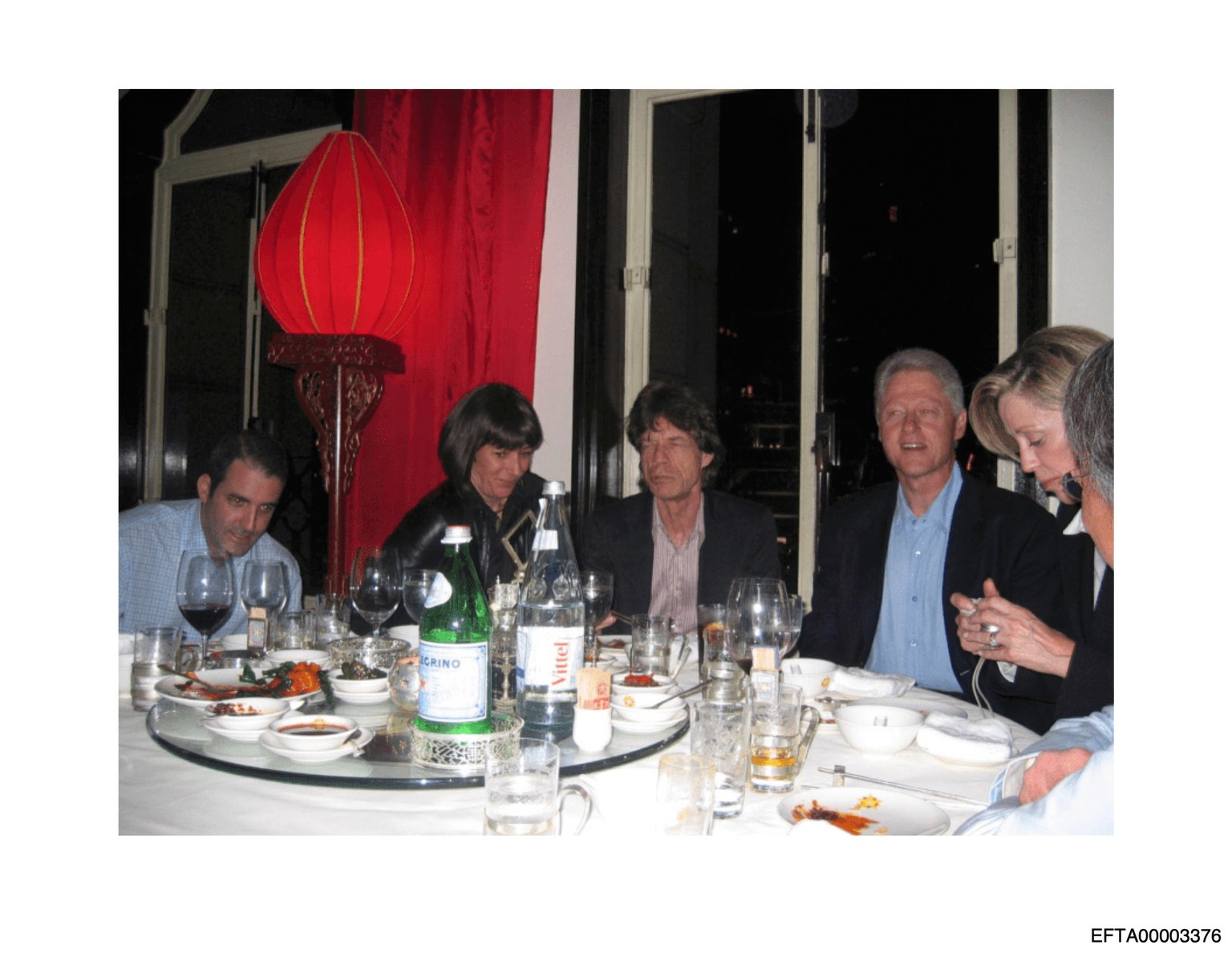 This undated photo released by the U.S. Department of Justice shows Ghislaine Maxwell, second from left, next to Mick Jagger, center, and former President Bill Clinton, third from right. (U.S. Departm ...