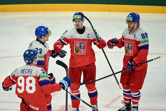 epa12126859 Czechia's Roman Cervenka (#10), center, celebrates with teammates Martin Necas (#98), Lukas Sedlak (#23) and David Pastrnak (#88) after scoring his team's first goal (3-1) during ...