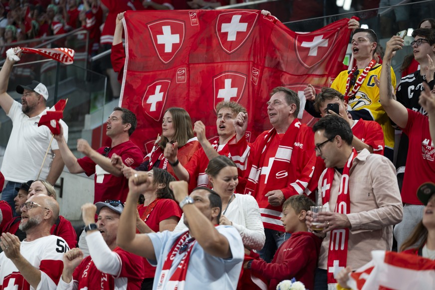 Swiss fans cheer during the 2026 IIHF Men's Ice Hockey World Championship preliminary round group A game between Switzerland and Finland, at the Swiss Life Arena ice hockey stadium, in Zurich, Sw ...