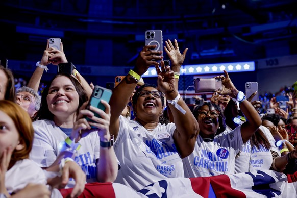 epa11601013 Supporters react as US Vice President and Democratic presidential nominee Kamala Harris speaks during a campaign rally at the Bojangles Arena in Charlotte, North Carolina, USA, 12 Septembe ...