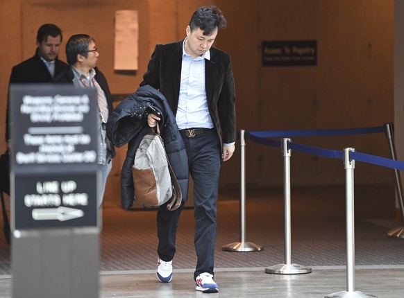 Liu Xiaozong, husband of Meng Wanzhou, Huawei&#039;s chief financial officer arrives at a Vancouver, British Columbia courthouse following a break in the bail hearing for his wife on Monday, December  ...