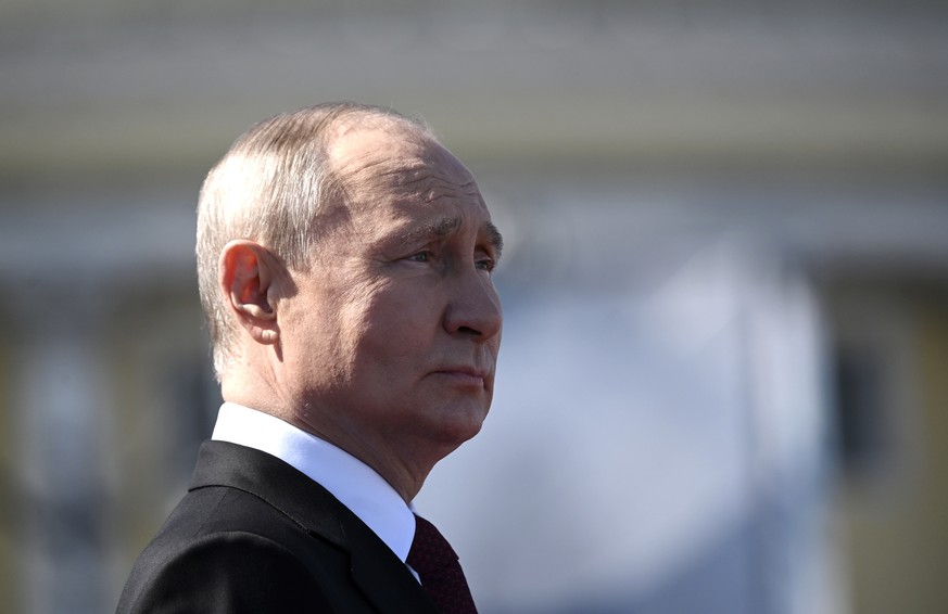 epa10776886 Russian President Vladimir Putin looks on as he attends the Navy Day parade, in St. Petersburg, Russia, 30 July 2023. President Putin announced that the Russian navy will get 30 new ships  ...