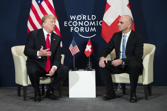 Swiss Federal President Alain Berset, right, and US President Donald J. Trump, left, discuss during a bilateral meeting at the annual meeting of the World Economic Forum, WEF, in Davos, Switzerland, F ...