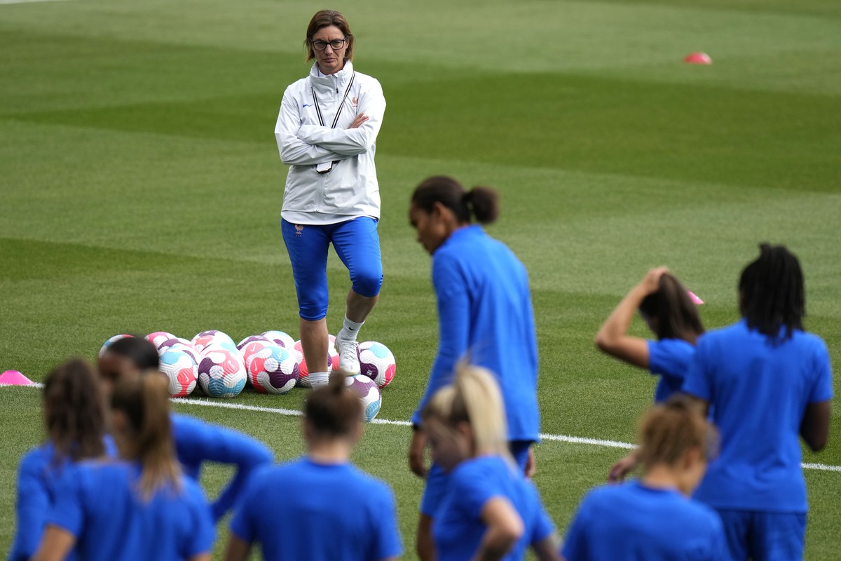 France's manager Corinne Diacre looks at players during a training session ahead of the Women Euro 2022 semi final soccer match between Germany and France, at MK stadium in Milton Keynes, England ...