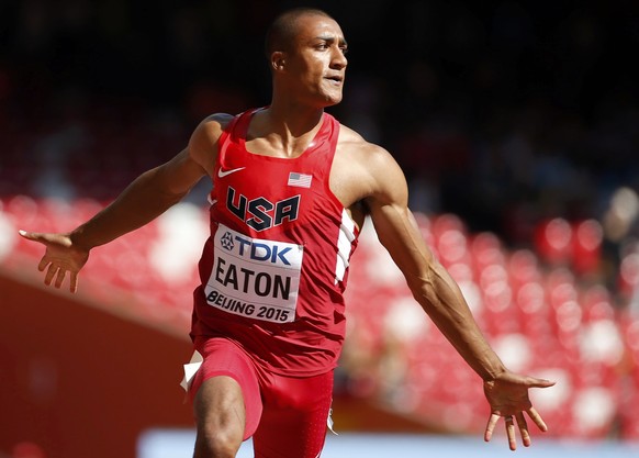 Ashton Eaton of the U.S. celebrates after winning the 100 metres decathlon event during the 15th IAAF World Championships at the National Stadium in Beijing, China August 28, 2015. REUTERS/Lucy Nichol ...